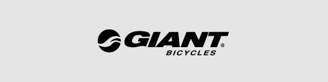 Logo mit dem Wort „Giant“ in fetten schwarzen Buchstaben neben einer stilisierten Welle. Darunter erscheint „Bicycles“ in kleineren schwarzen Buchstaben. Der Hintergrund ist hellgrau.