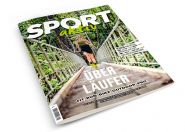 Titelbild der Zeitschrift „Sport aktiv“ mit einer Person, die über eine Waldbrücke rennt. Die Überschrift lautet „Über Läufer“ und der Text hebt Fitness und Outdoor-Aktivitäten wie Laufen und Radfahren hervor. Der Hintergrund zeigt üppige grüne Bäume.