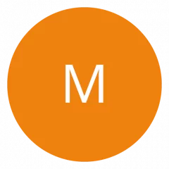 Ein orangefarbener Kreis mit einem weißen Buchstaben „M“ in der Mitte.