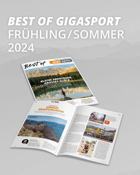 Gezeigt wird ein Magazin mit dem Titel „Best of Gigasport Frühling/Sommer 2024“. Auf dem Cover ist ein von Bergen umgebener See abgebildet. Auf einer weiteren Seite werden ein Abenteuerartikel und ein Sportevent mit lebendigen Fotos und Texten vorgestellt.