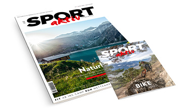 Es werden zwei SPORT aktiv-Magazine gezeigt. Das größere zeigt eine malerische See- und Berglandschaft, das kleinere einen Radfahrer auf einem holprigen Trail. Auf beiden ist der Markenname prominent platziert.