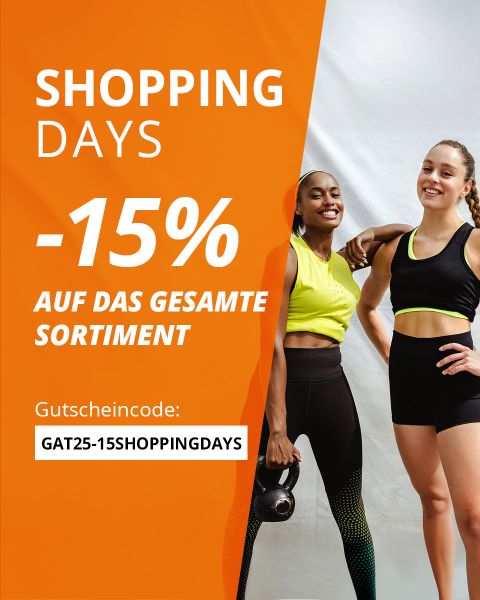 Zwei Frauen in Sportkleidung lächeln vor einem weiß-orangefarbenen Hintergrund. Der Text wirbt für "Shopping Days" mit 15 % Rabatt auf alle Produkte unter Verwendung des Codes "GAT25-15SHOPPINGDAYS" auf Deutsch.