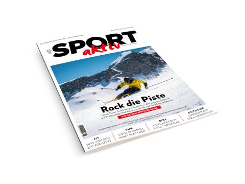 Titelbild der Zeitschrift Sportaktiv mit einem Skifahrer in einer gelben Jacke, der auf einem verschneiten Berg bergab fährt, mit Artikelüberschriften auf Deutsch.