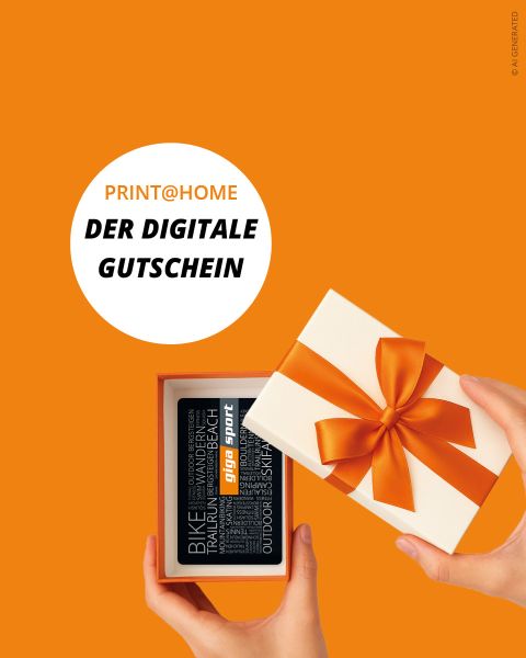 Eine Hand öffnet eine weiße Geschenkbox mit orangefarbener Schleife und enthüllt eine digitale Geschenkkarte. Der Text lautet: "PRINT@HOME DER DIGITALE GUTSCHEIN.