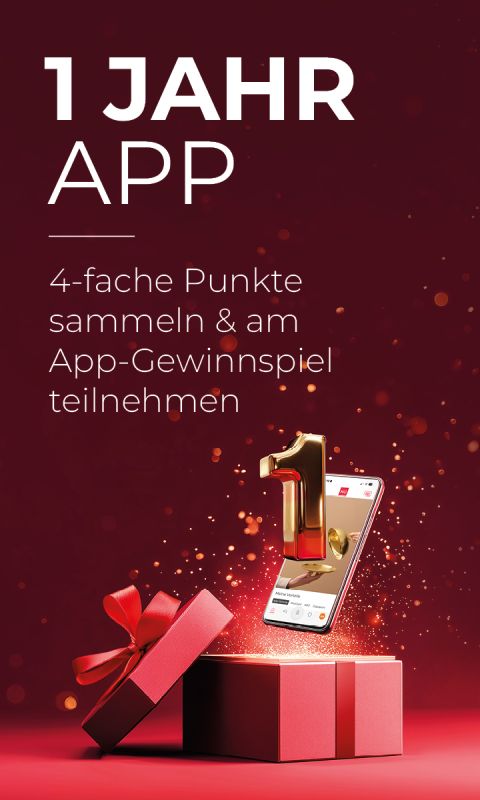 Roter Hintergrund mit dem Text "1 Jahr App", einem Smartphone und einer goldenen Zahl 1, die aus einer Geschenkbox herausragt, und einem roten Band.