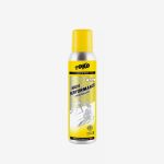 Eine gelb-silberne Dose mit „Toko High Performance Liquid Paraffin“-Wachs für die Pflege von Skiern und Snowboards, mit einer Abbildung eines Skifahrers auf dem Etikett.