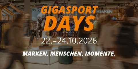 Werbegrafik für die Gigasport Days vom 22. bis 24. Oktober 2026 mit dem Slogan „Marken. Menschen. Momente.“ in einer Ladenumgebung.