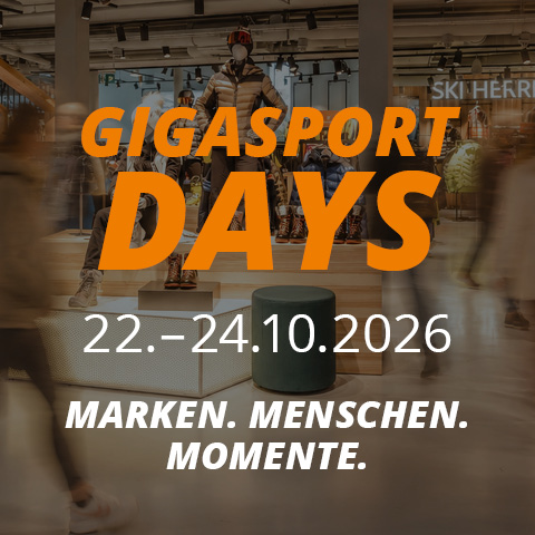 Werbegrafik für die GIGASPORT DAYS vom 22. bis 24. Oktober 2026 mit dem Slogan „MARKEN. MENSCHEN. MOMENTE.“ vor dem Hintergrund eines verschwommenen Ladeninterieurs.